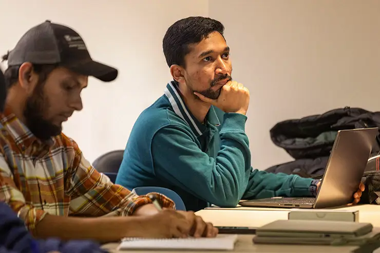 a SEMO international student sits in class and listens to the instructor