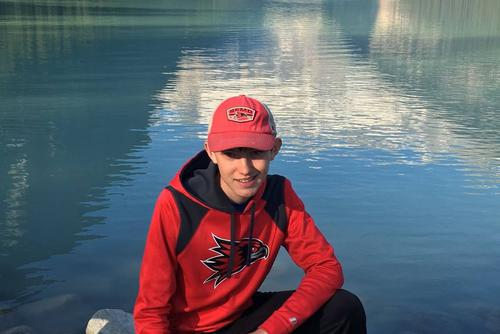 Scholarship program awardee posing by a lake in SEMO gear.