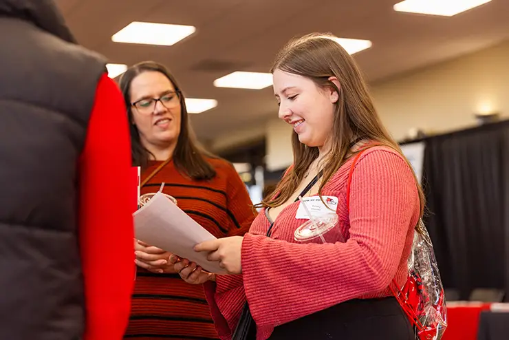 a SEMO student and her parent review a handout together during a campus visit