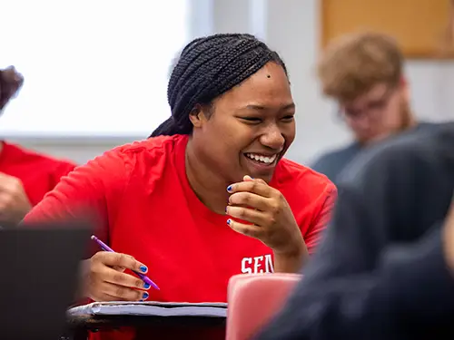 a SEMO student in class laughs