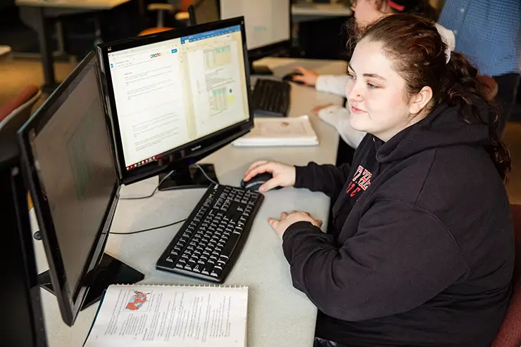 a SEMO student works at a computer