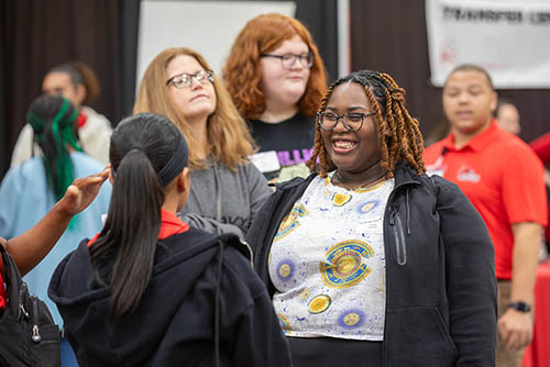 two students talking and laughing during Show Me Day on their college visit day