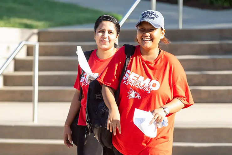two people visiting SEMO cross campus in the sunshined