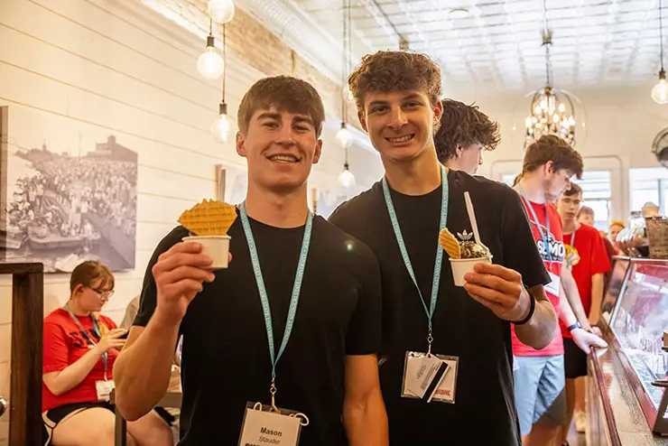 two semo camp redhawk students pose with their ice cream for a photo