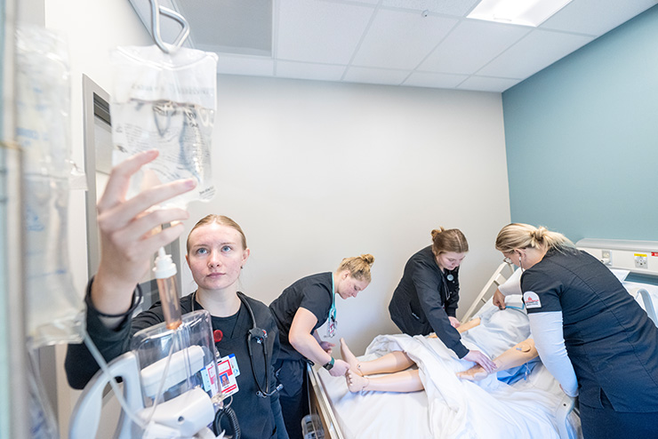 Nursing students at SEMO practicing in a simulation lab.