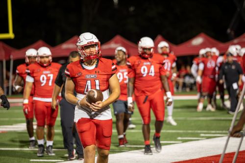 SEMO football player holds the football during a game at Houck Stadium.