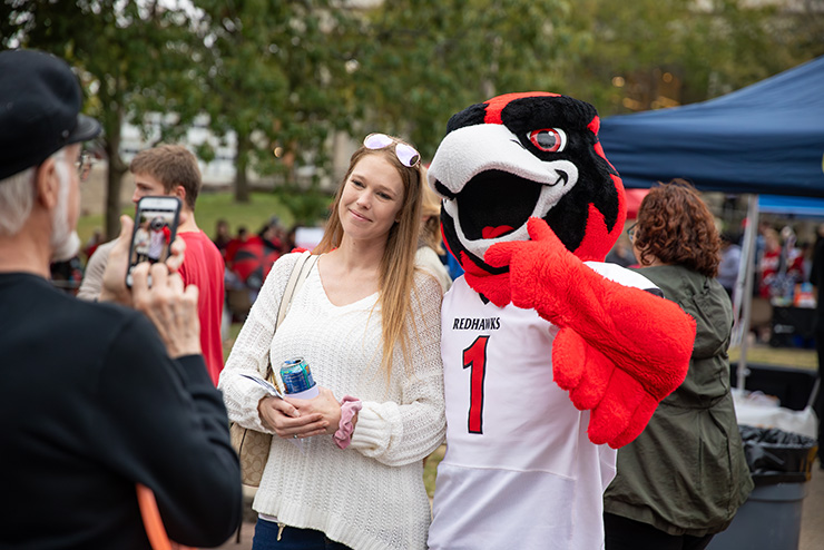A SEMO fan gets her picture taken with Rowdy.