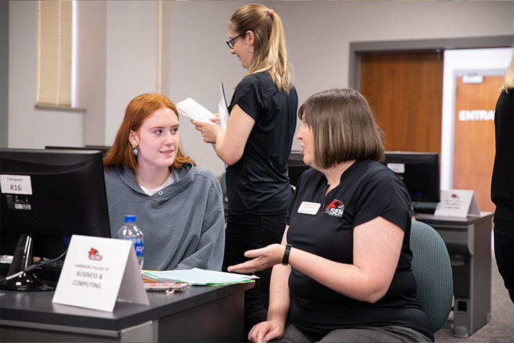 Prospective student working with someone to help them set their class schedule
