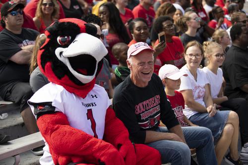 Rowdy taking a photo with semo football fans