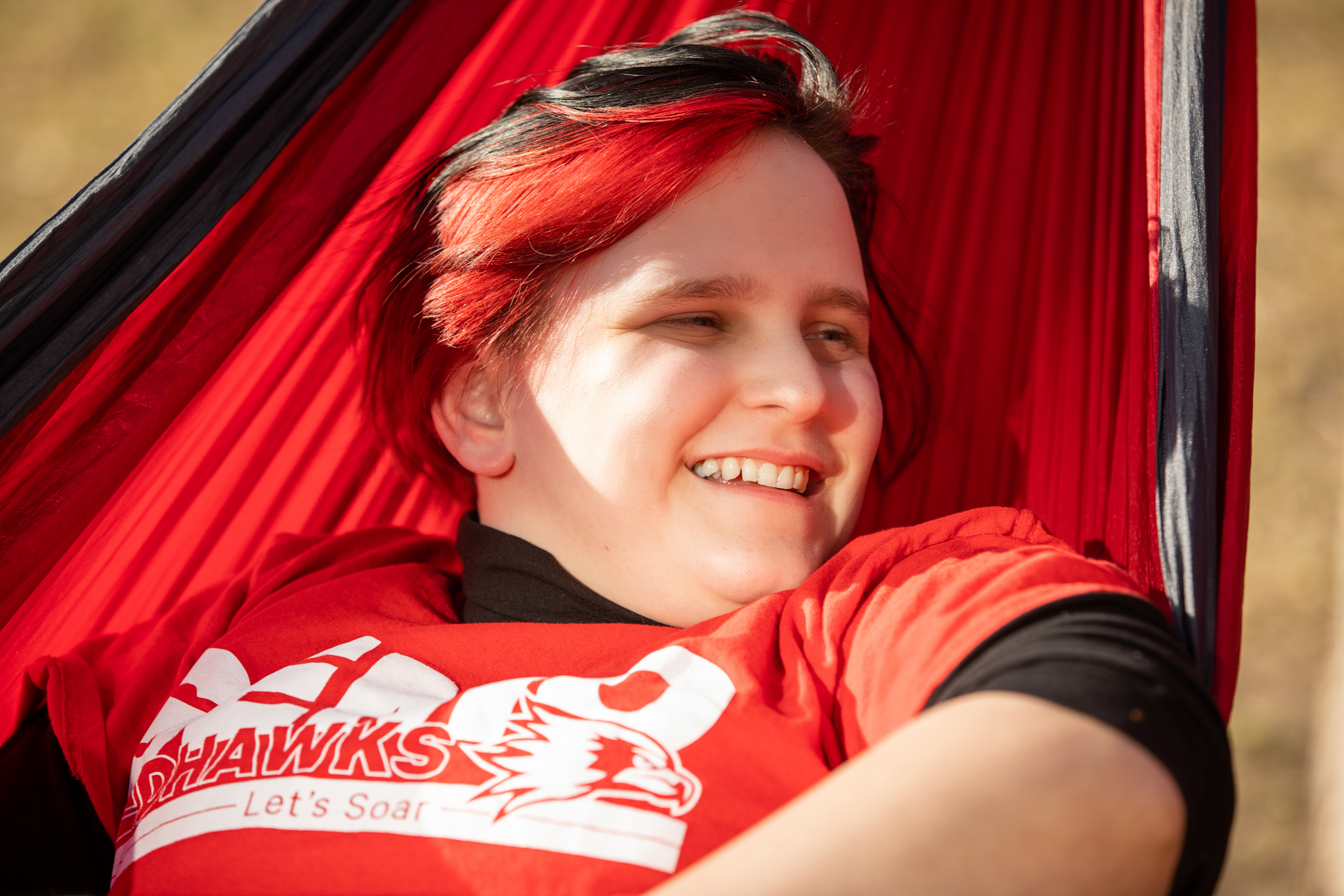 Student relaxing on the hammocks that are found throughout SEMO's campus. 