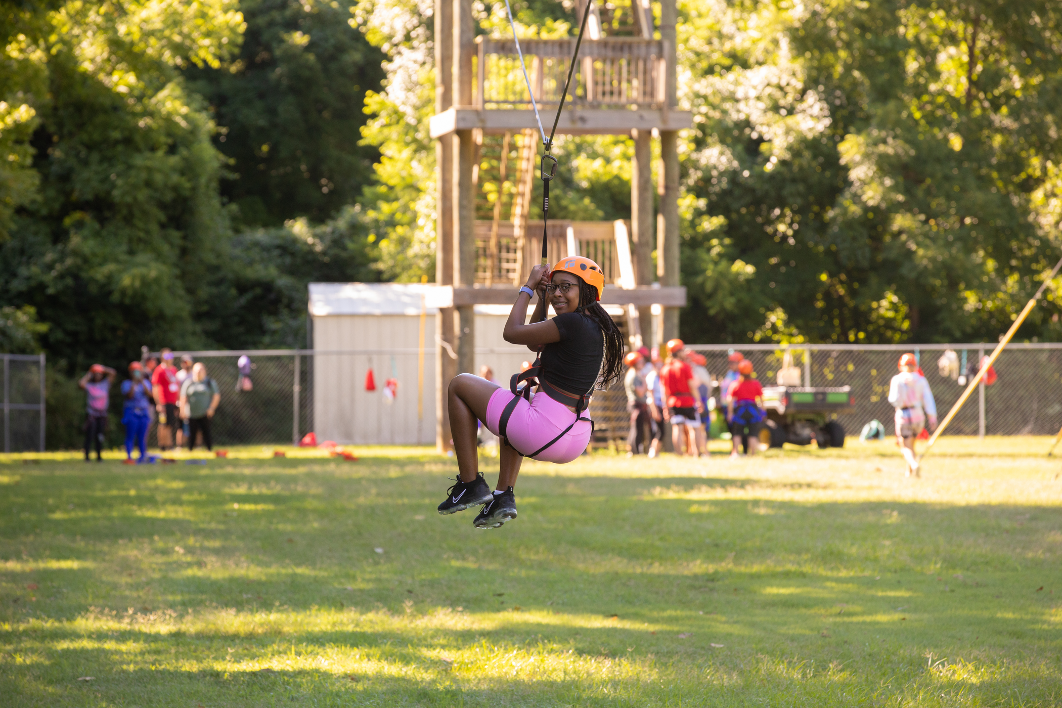 Incoming SEMO student ziplining across our ropes course at Camp Redhawk. 
