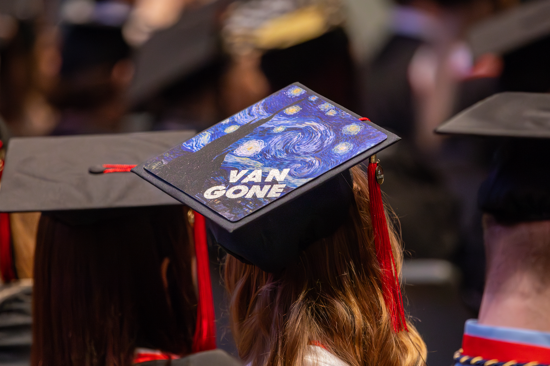 Graduation cap mimicking Van Gough's "Starry Night" painting with the words "Van Gone" on top of it.