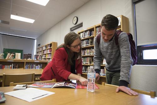 Lenell Hahn, Director of Admissions at Southeast, works with a high school student.