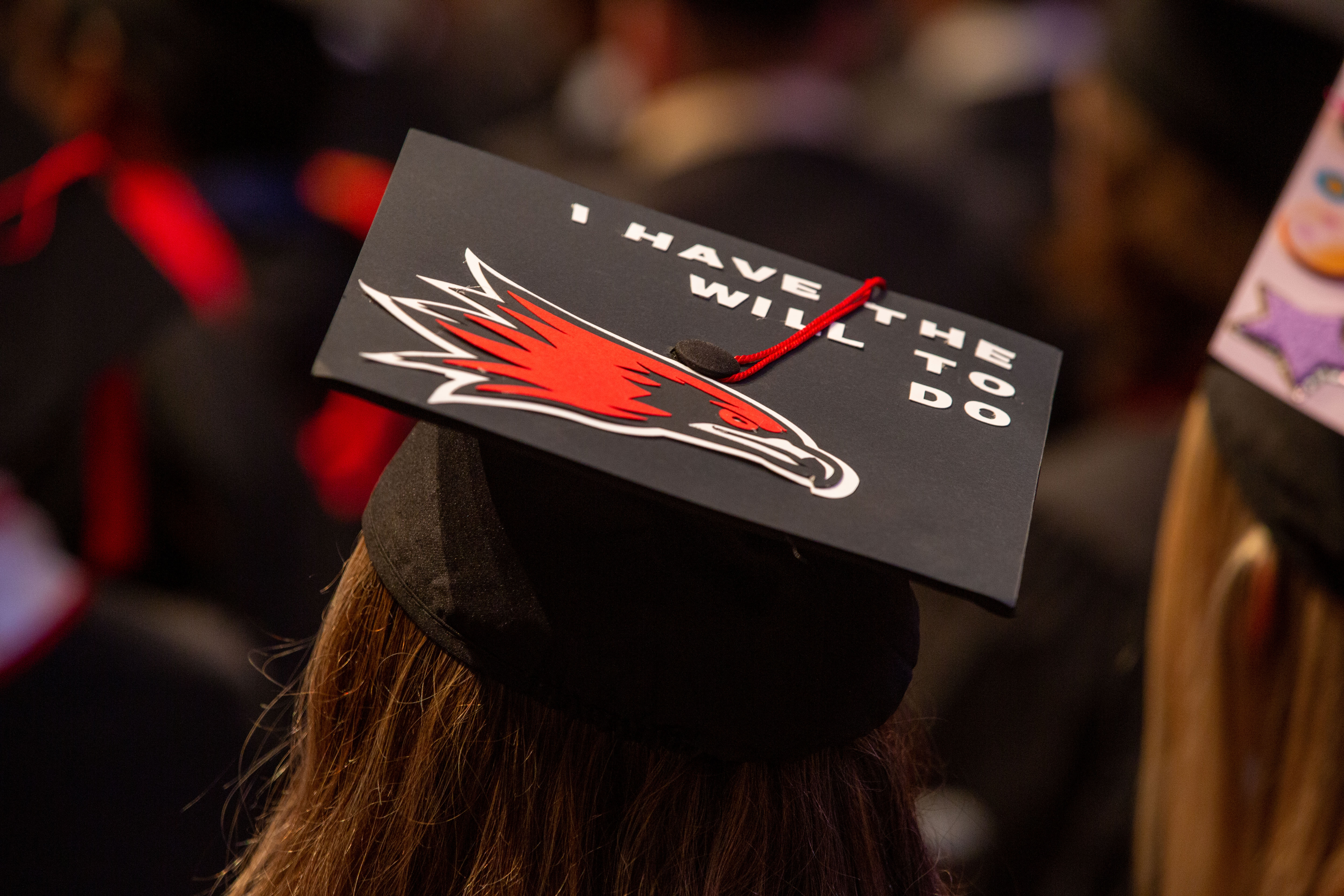 Students graduation cap that says "I have the will to do"