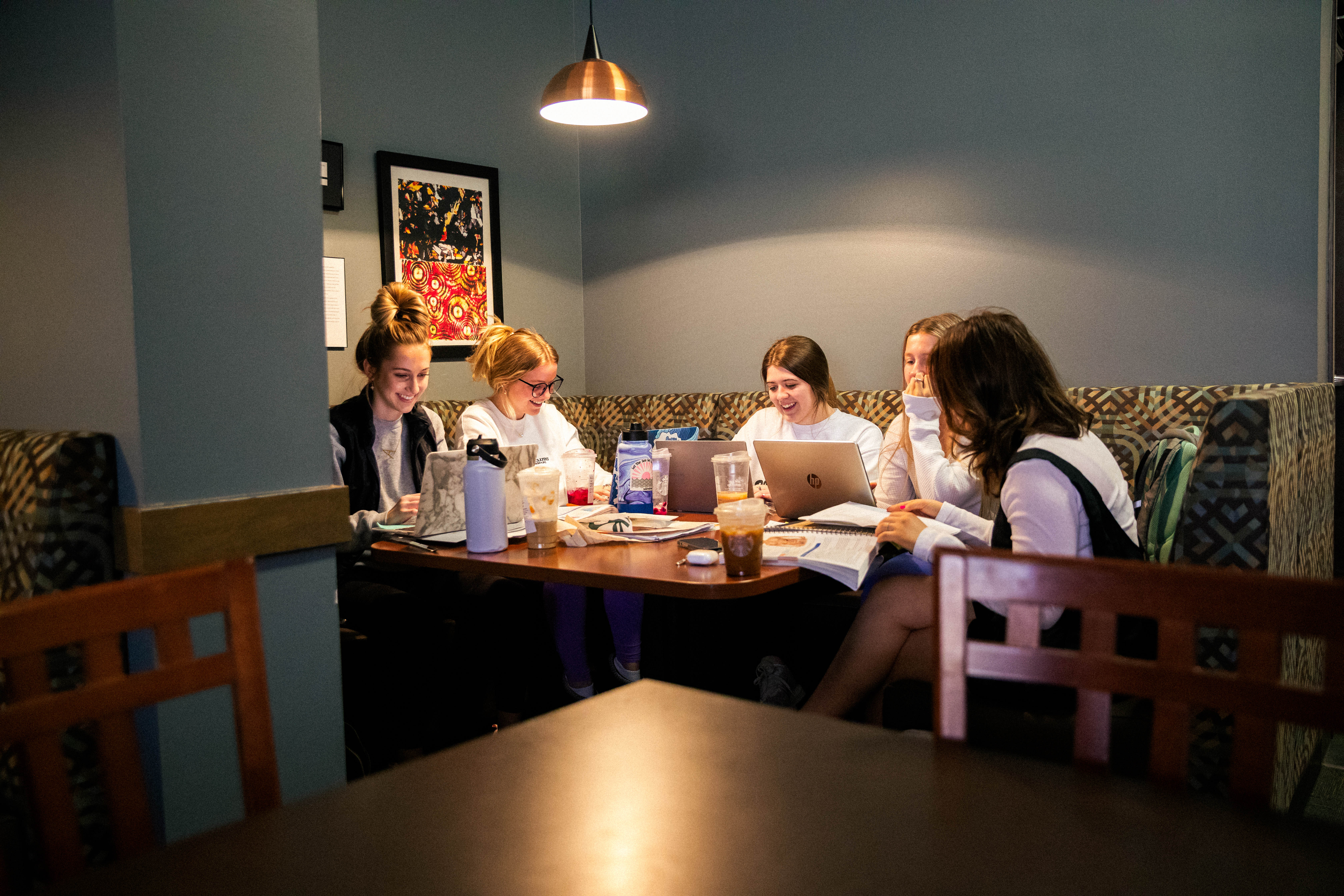 College students sitting around a table studying and chatting at an on-campus coffee shop at Southeast Missouri State University
