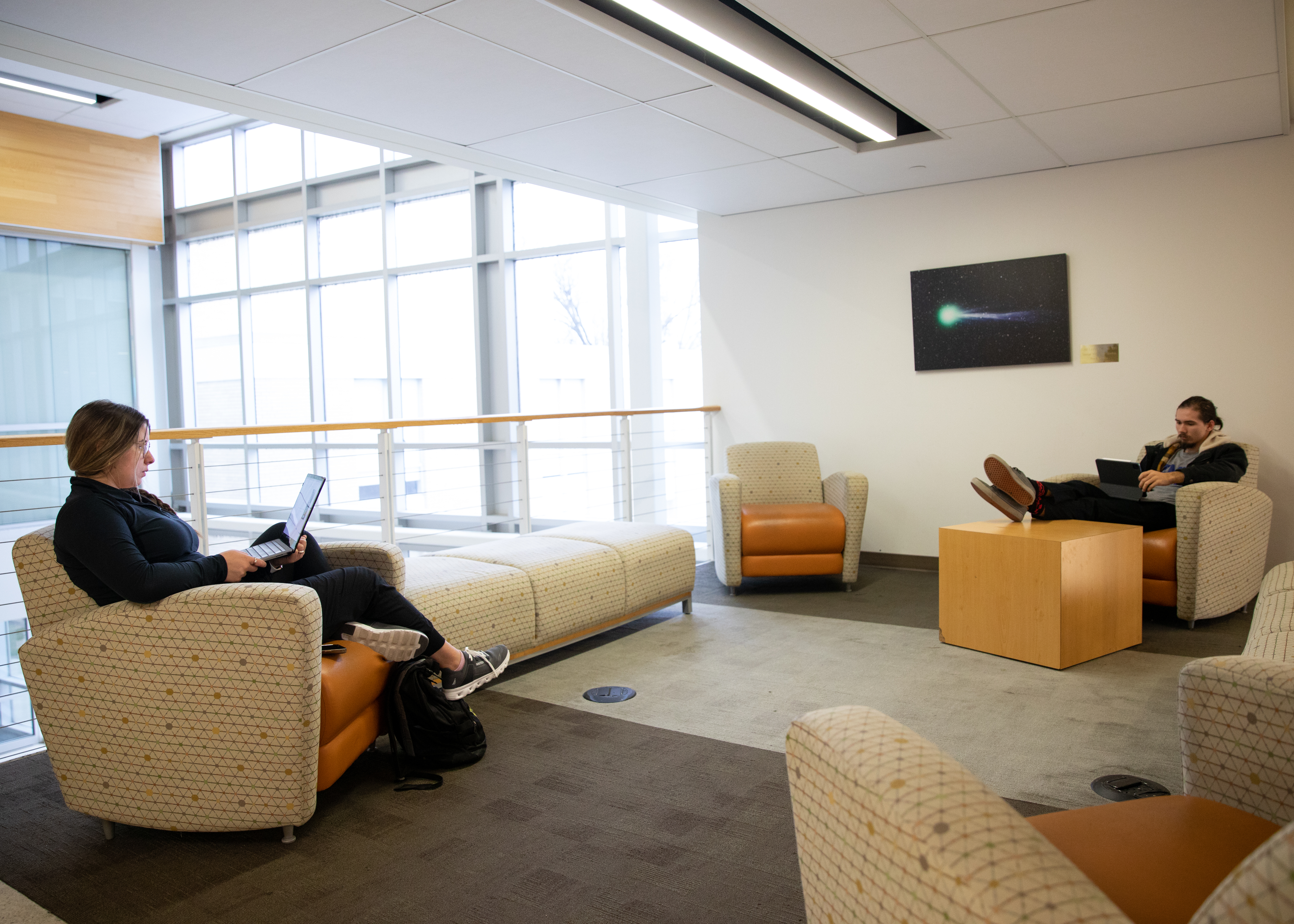 Two students studying in the Magill common area.