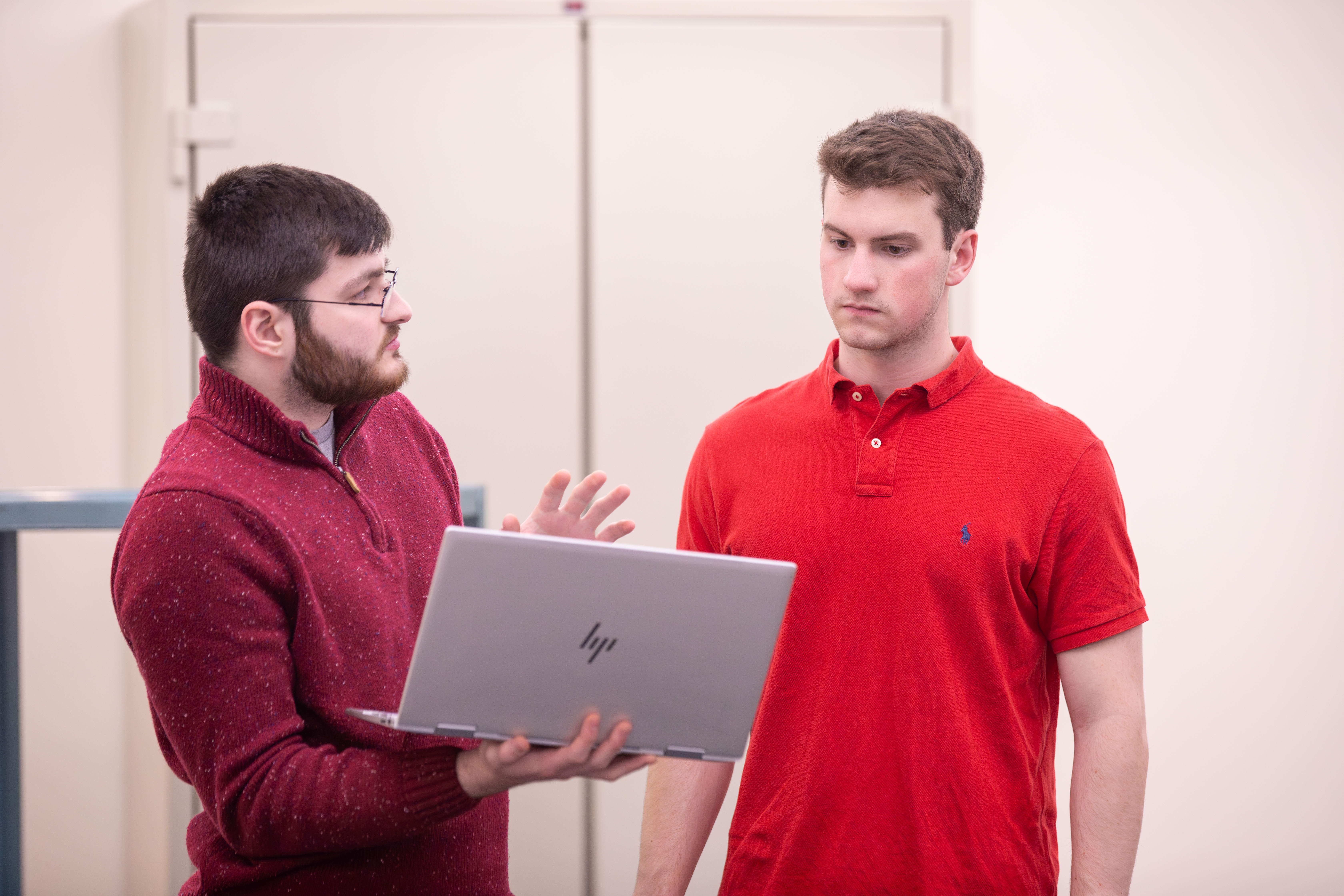 Students looking at a laptop