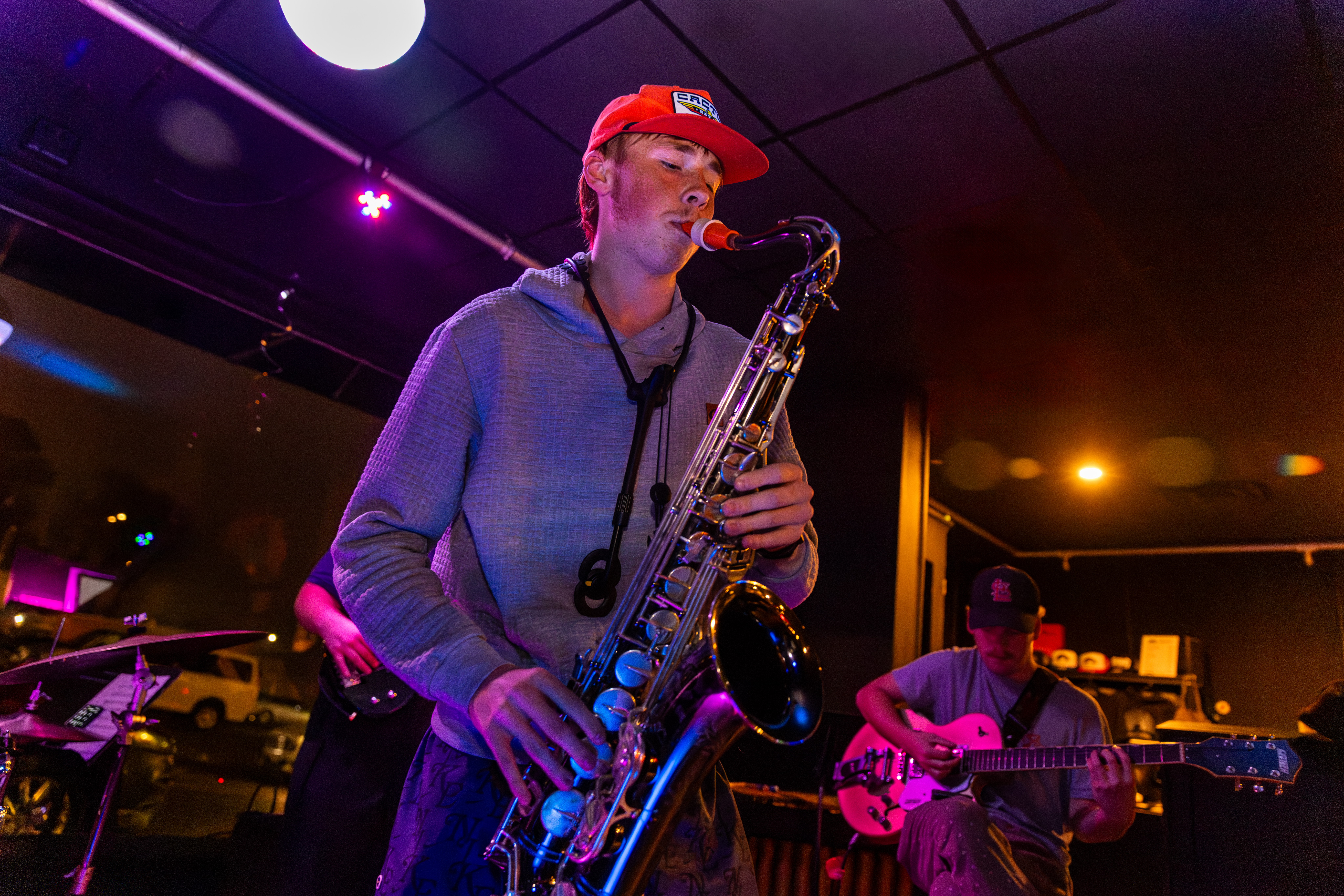 SEMO Music students playing Jazz at Spectrum record lounge. Brass instruments and a guitar.
