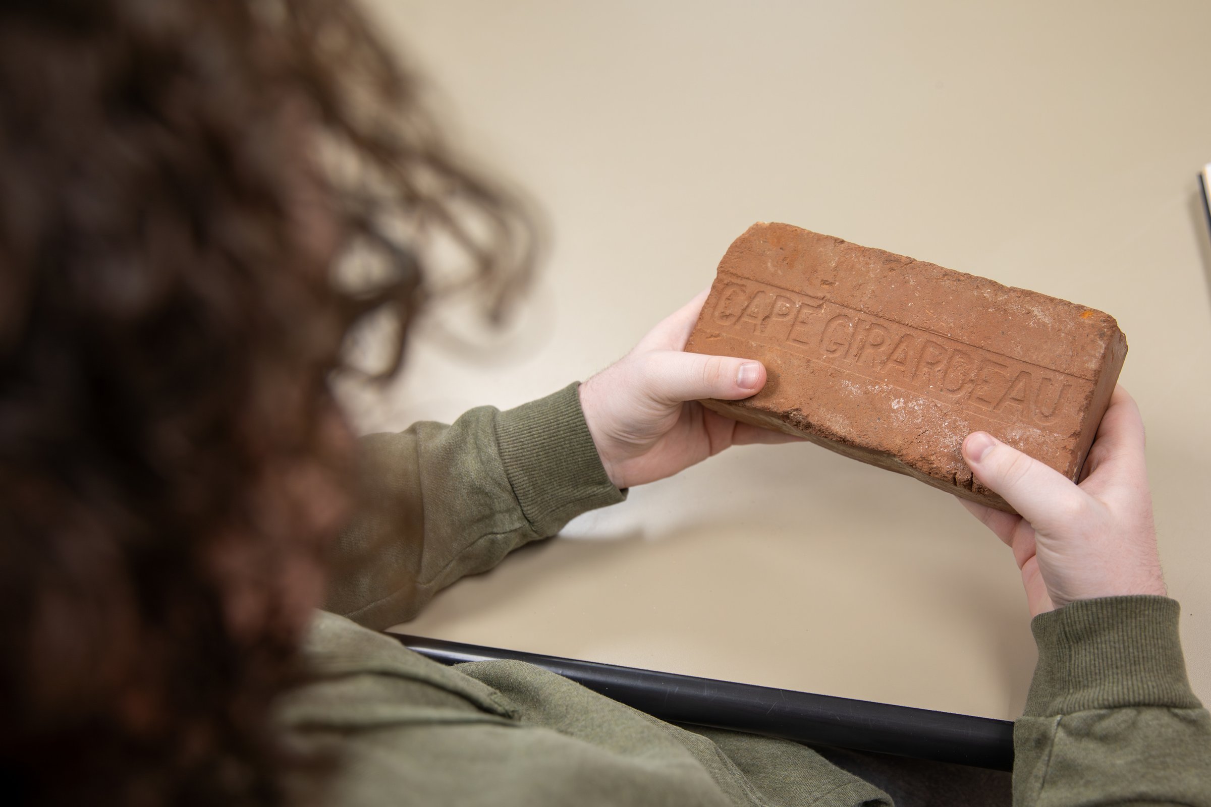 A historic brick with "Cape Girardeau" engraved 