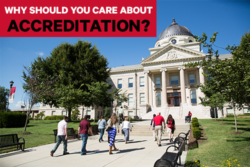 Why should you care about accreditation? A group of people walk toward Academic Hall.