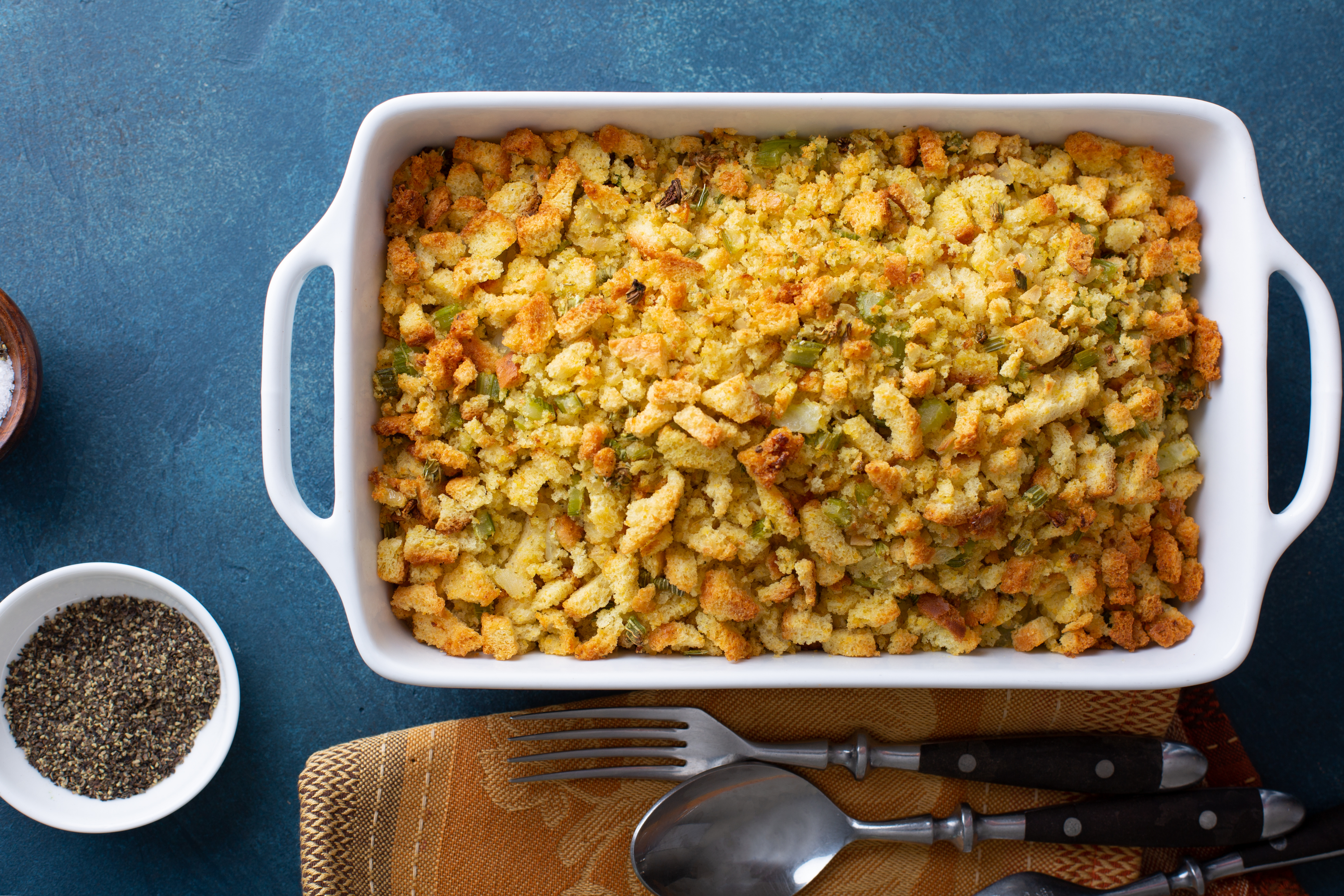 A casserole dish of stuffing pictured from above.  