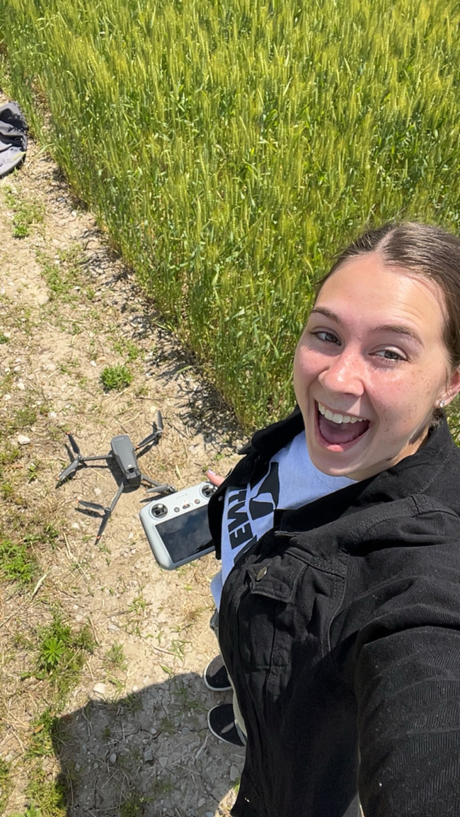 SEMO Agriculture major Lainey Canning smiles as she uses her drone on the farm for hands-on learning. 