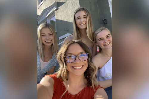 Erica and friends smile for a photo.