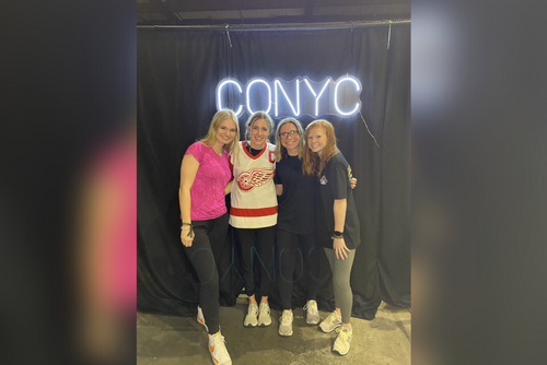 Erica and friends take a photo at an event.