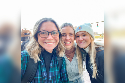 Erica and friends smile for a photo.