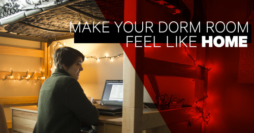 A student sitting at her desk in a dorm room