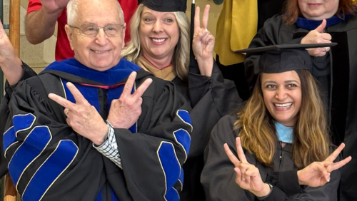 Dr. Wilson and Dr. Gupta pose with several other SEMO employees and faculty.