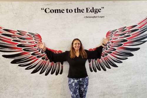 Dr. Gupta poses at the wing wall during a visit to SEMO.