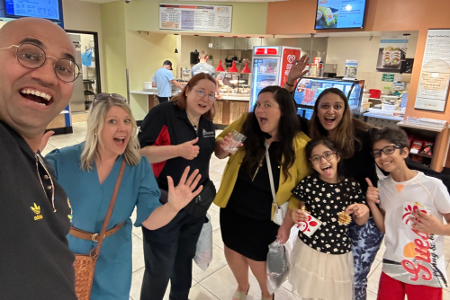 The Gupta family poses with SEOnline staff at the University Center