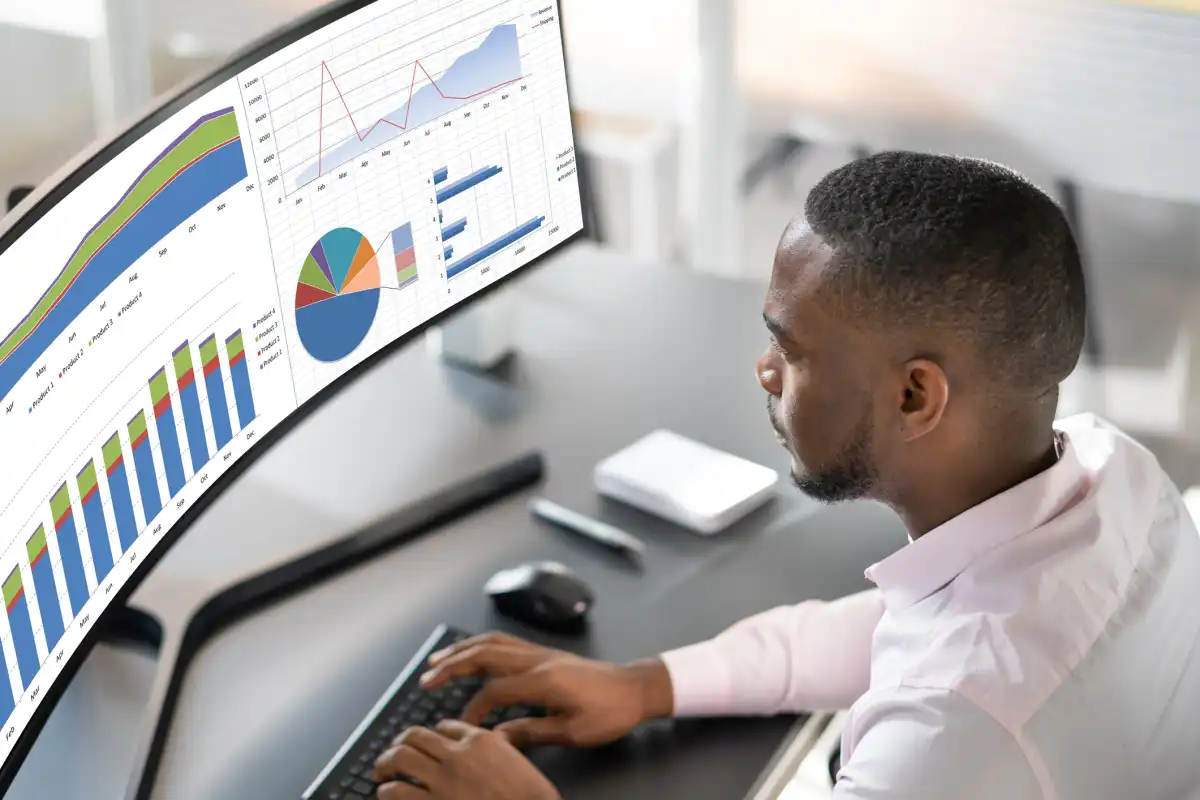 A healthcare data analyst works on a dashboard report. 