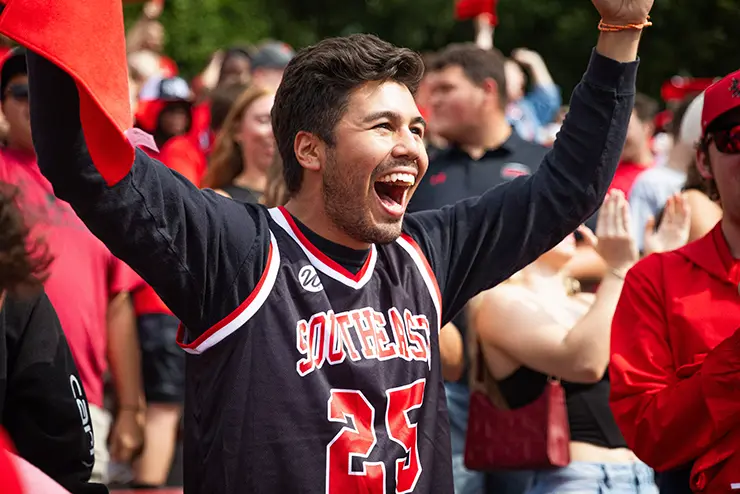a SEMO student cheers during a football game