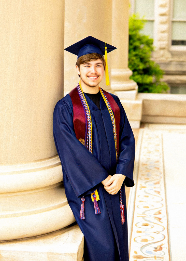 Nathan Harris, a SEMO President Scholarship Recipient, graduating in his cap and gown from the SEMO Aviation program.