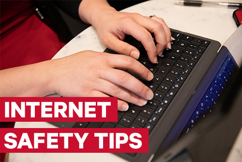 Internet Safety Tips. Hands on a keyboard of a laptop.