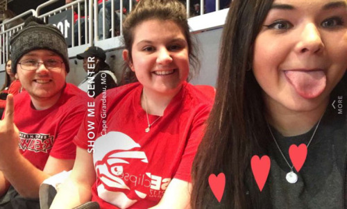 A selfie of Skylar, Nicole, and Bethany in the bleachers at a game. 