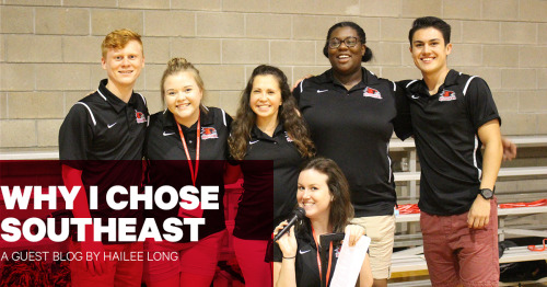 A group of Southeast students wearing matching polos smiling for a group photo.