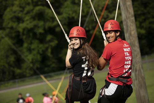 Two students complete the High Ropes Challenge Course. 
