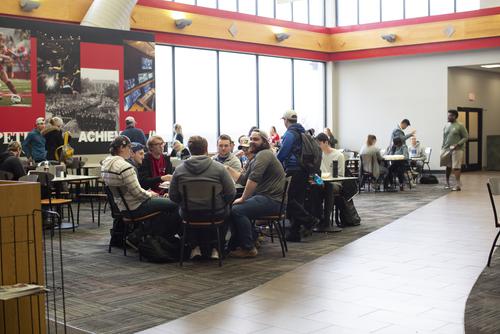 Students sit at tables in a Redhawks Market dining area in the University Center.