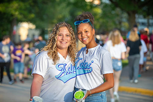 two SEMO students post together for a photo during the annual welcome back involvement fair