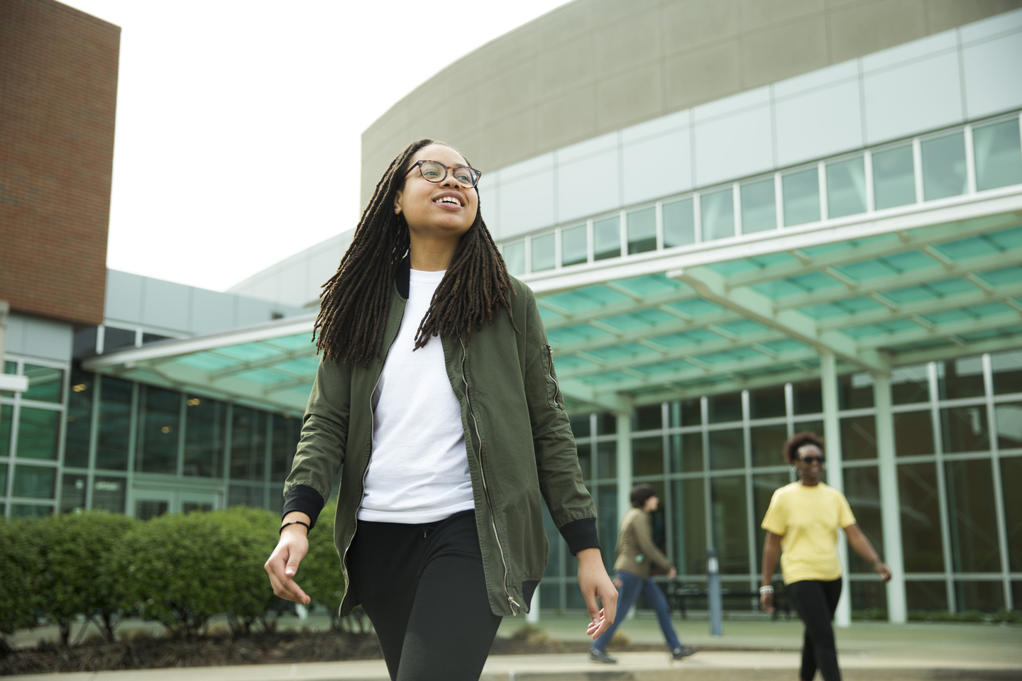 After class, a student walks out of the Cultural Arts Center at the River Campus. 