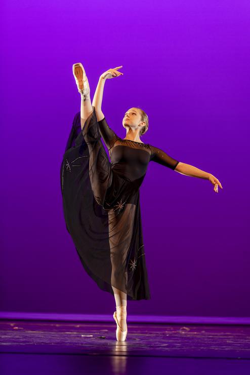 A theatre and dance student performs on stage.