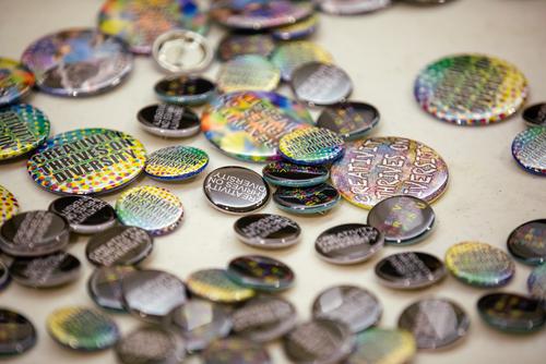 A table with buttons advocating for diversity during the Bridges event 
