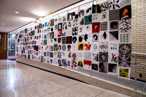 Pieces of student artwork quilted together to celebrate black women’s hair, the theme of the Bridges event 