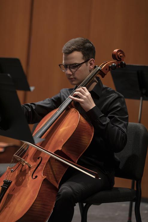 A music student plays the cello during a Symphony Orchestra Performance.