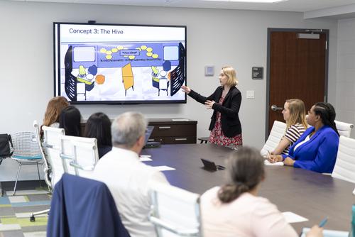 Interior Design student presents their design concepts to a panel of professionals.