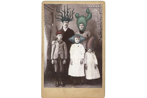 An old-fashioned photo of a man, woman, and three young children, each with a futuristic head piece painted on their heads. 
