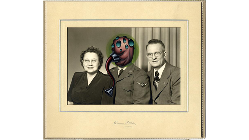 An old-fashioned photo of a woman and two men sitting in a row. The man in the middle has a mauve blob painted over his face with a green ring around it and a tube protruding from his mouth. 